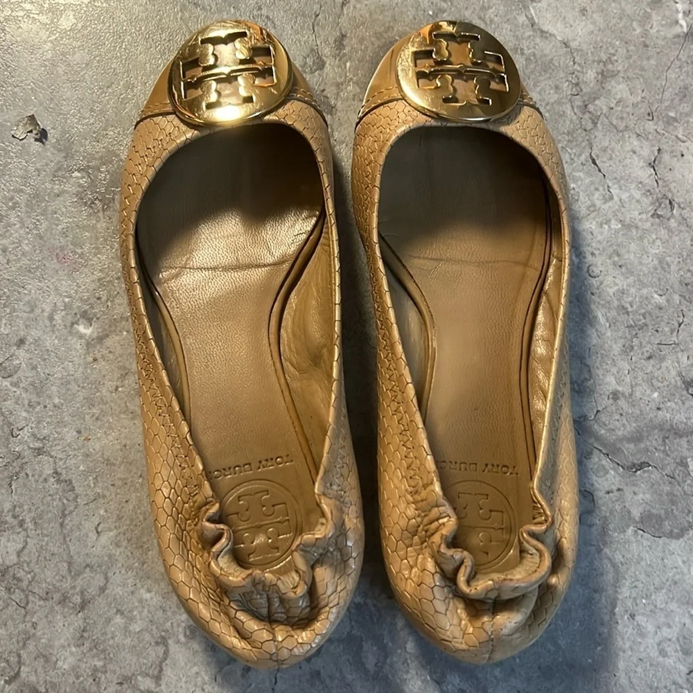 Tan Tory Burch flats with gold emblem